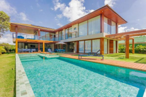 PF16 Casa Alto Padrão 5 Suítes - Praia Bella, com acesso exclusivo à praia!